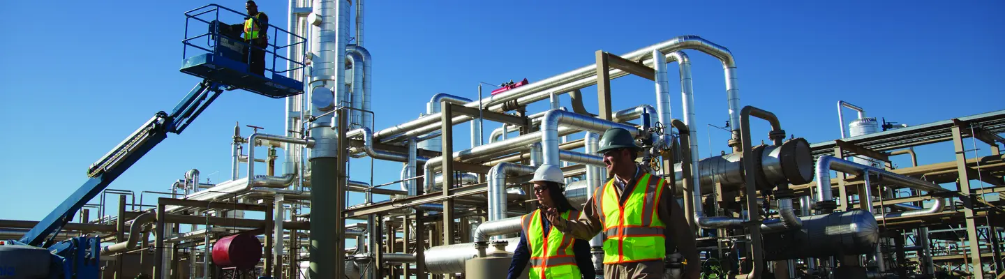 Construction managers in front of power plant