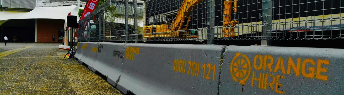 Safety barriers installed around a construction site to protect workers and restrict unauthorized access.