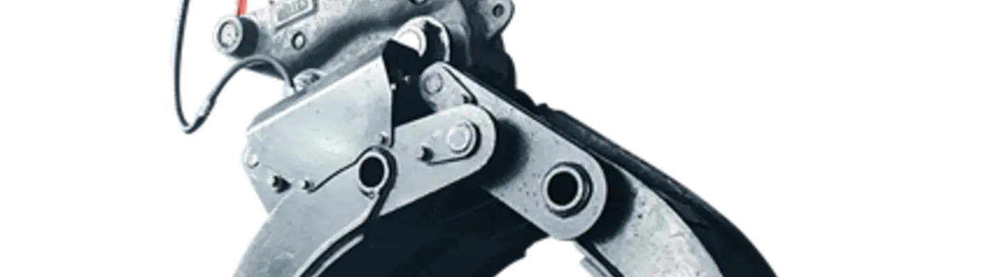 Close-up of a rock grab attachment mounted on heavy machinery, designed for handling large rocks at construction sites.
