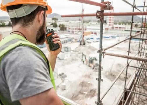 worker talking into radio