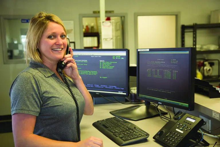 woman on phone at desk