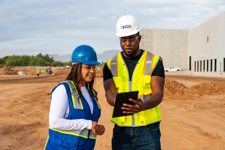 man and woman with tablet