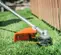 Orange and silver STIHL Brush Cutter, Gas Powered