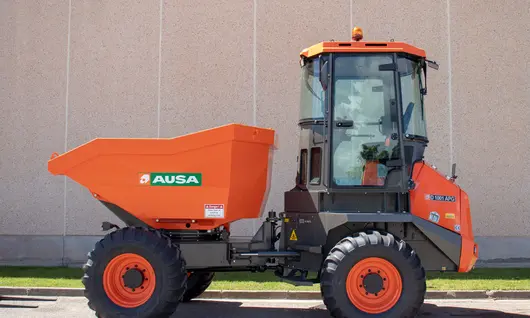 A dumper vehicle operating on a construction worksite, transporting materials to support ongoing building activities.