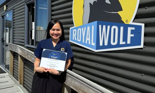 Sales representative receiving a Top Sales award certificate during a recognition ceremony.